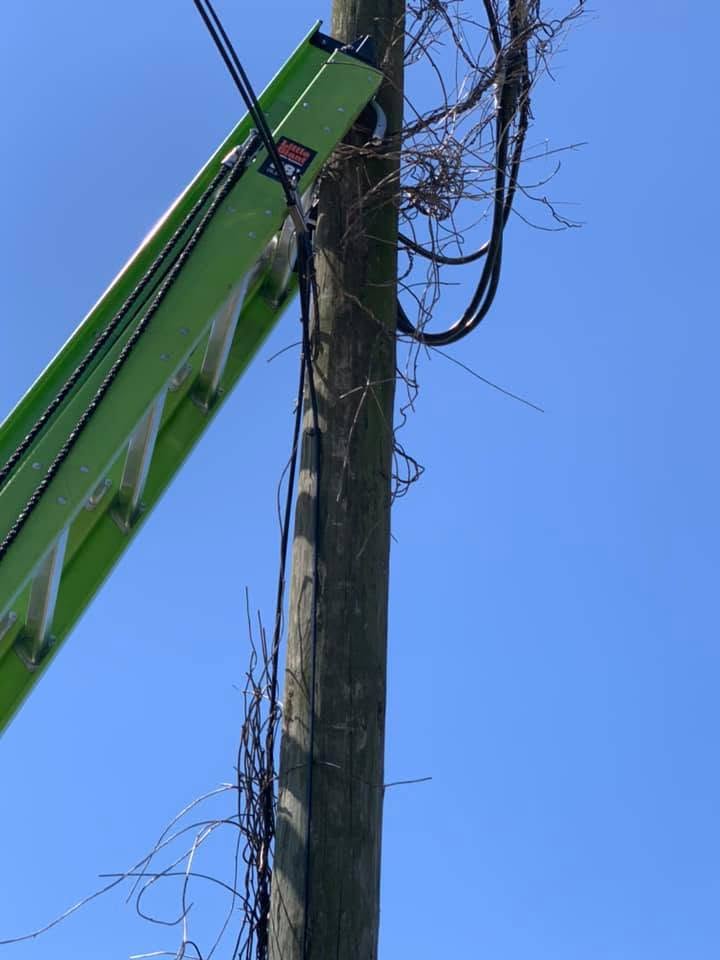 Aerial lift work on utility pole